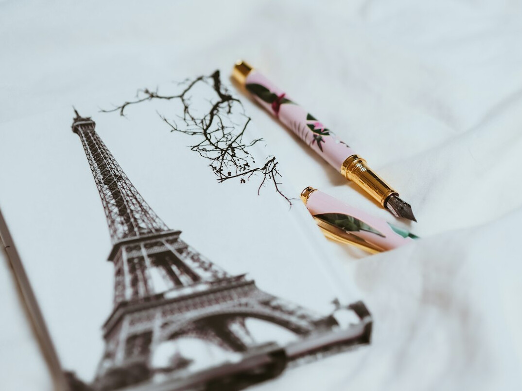 Pen and notebook on a writer's desk